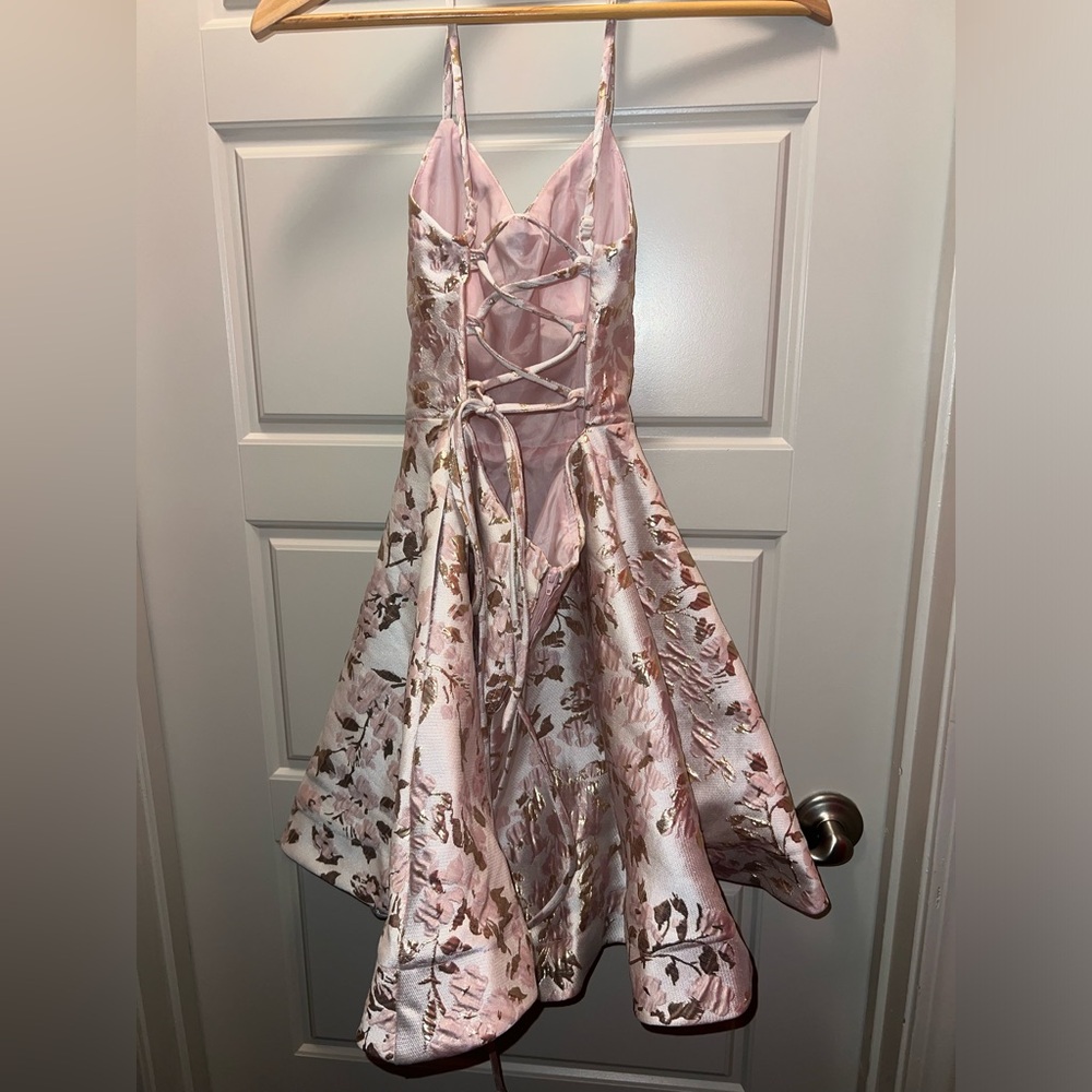 B. Darlin White Dress with Gold and Pink Floral Pattern